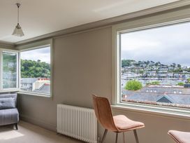 A living room with a sofa and a chair at George House in Dartmouth