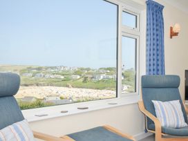 A living room with a view of the beach at Zapadiah in Polzeath
