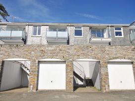 A building with balconies and garage doors at Slipway 15 in Rock