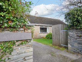 A house entrance with a gate and sign at Avoca in Rock