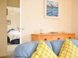 A living room with a sofa and cushions at Avoca in Rock