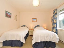 A bedroom with two beds and a window at Avoca in Rock
