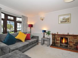 A living room with a sofa and fireplace at Hazelhurst in Rock