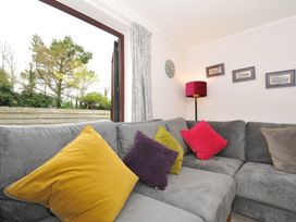 A living room with cushions on a sofa at Hazelhurst in Rock