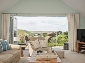 A living room with a sofa and coffee table at Farlands, Daymer Bay