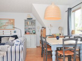 A dining room with a table and chairs at Rocklings in Rock