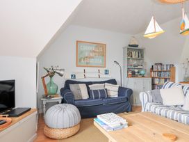 A living room with a blue sofa and wooden coffee table at Rocklings in Rock