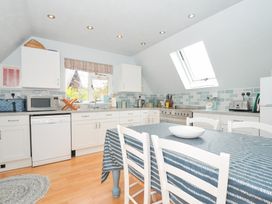 A kitchen with cabinets and appliances at Rocklings in Rock