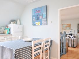A kitchen with a dining table and chairs at Rocklings in Rock