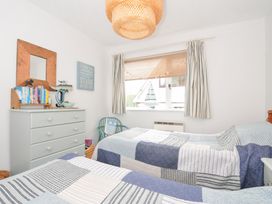 A bedroom with two beds and a dresser at Rocklings in Rock