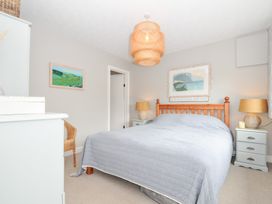 A bedroom with a bed and nightstands at Rocklings, Rock