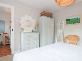 A bedroom with a bed and furniture at Rocklings, Rock