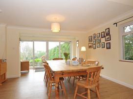 A dining room with a large table and chairs at Tregillan in Rock