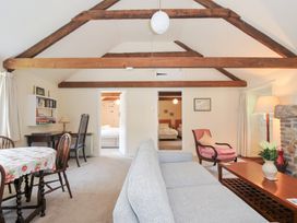 A living room with a sofa and table at Mill Pond in Rock