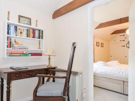 A study room with a desk and bookshelf at Mill Pond in Rock