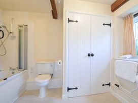 A bathroom with a bathtub and shower at Mill Pond in Rock