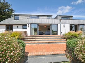 A house with large windows and steps at Porthilly Brook in Rock