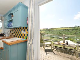 A kitchen with a sink and counter at Cartway Cove in Port Isaac