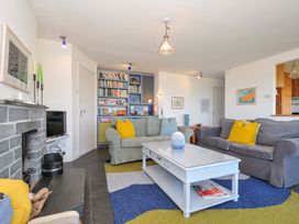 A living room with a sofa and coffee table at Upper Gren in Trebetherick