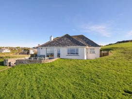 A house with outdoor seating area at Upper Gren in Trebetherick