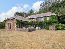A house with a garden and patio at The Old Granary in Rock