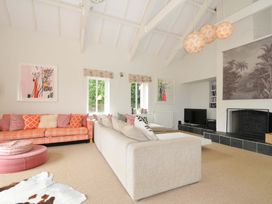 A living room with a sofa and television at The Old Granary in Rock