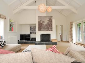A living room with a television and fireplace at The Old Granary in Rock