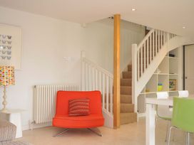 A living room with a staircase and furniture at The Old Granary in Rock