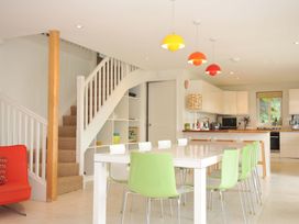 A kitchen with a dining table and chairs at The Old Granary in Rock