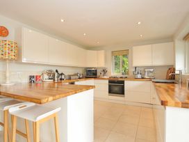 A kitchen with appliances and wooden surfaces at The Old Granary in Rock