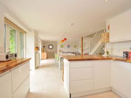 A kitchen with wooden countertop and dining area at The Old Granary in Rock