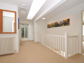 A hallway with a mirror and radiator at The Old Granary in Rock