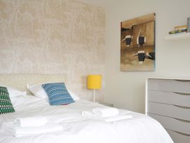 A bedroom with a bed and pillows at The Old Granary in Rock
