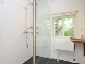 A bathroom with a shower and sink at The Old Granary in Rock