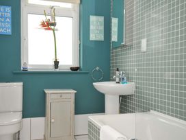 A bathroom with a toilet sink and bathtub at The Point in Polzeath