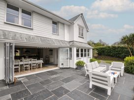 A patio with seating and a table at Cherrytrees in Rock