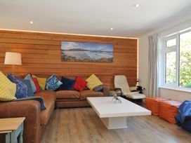 A living room with a sofa and coffee table at Beaches in Polzeath
