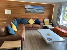 A living room with a sofa and coffee table at Beaches Polzeath