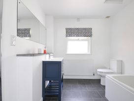A bathroom with a sink toilet and bathtub at Corriana in Rock