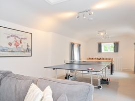 A game room with foosball and ping pong tables at Orchard Cottage Polzeath