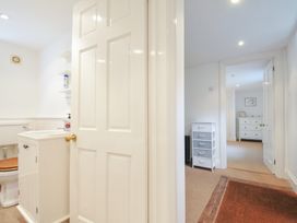 A bathroom with a toilet and sink at Orchard Cottage in Polzeath