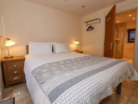 A bedroom with a bed and nightstand at Brush and Boot in York