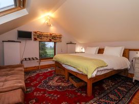 A bedroom with a bed and TV at Brush and Boot in York