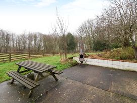 An outdoor area with a table and benches at Brush and Boot in York
