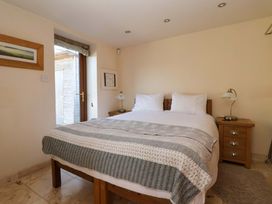 A bedroom with a bed and side table at Brush and Boot in Stittenham near York