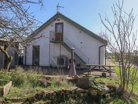 A building with a staircase and table at Brush and Boot in Stittenham near York
