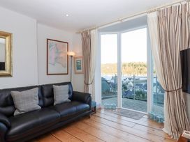 A living room with a sofa and a view at 13 Above Town Dartmouth