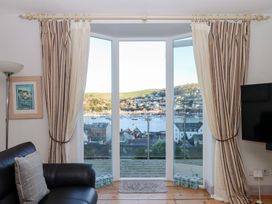 A living room with a view of the harbor at 13 Above Town in Dartmouth