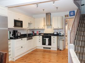 A kitchen with appliances and storage spaces at 13 Above Town in Dartmouth