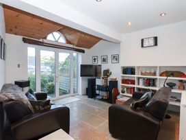 A living room with a sofa and television at 13 Above Town in Dartmouth